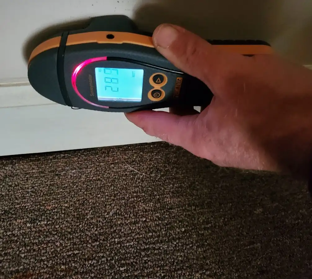 Moisture detection at baseboard during Storm Damage Restoration in Coachella